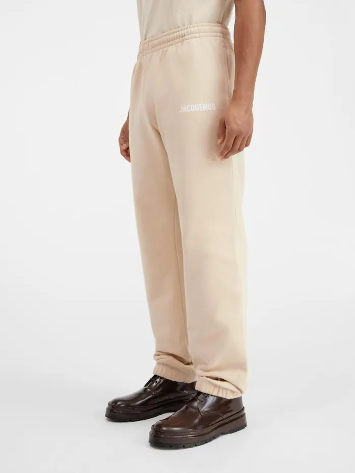 The Jacquemus Track Pants Light Beige WomenMen JACQUEMUS Sweatshirts and Joggings The Jacquemus Track Pants Light Beige WomenMen JACQUEMUS Sweatshirts and Joggings