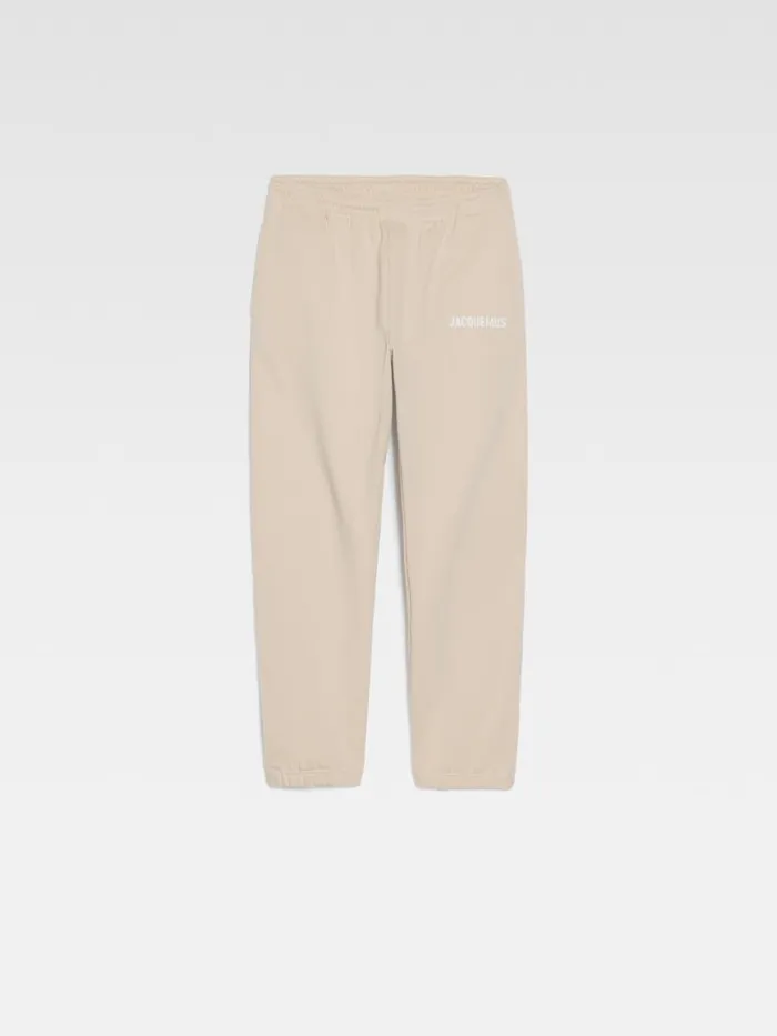 The Jacquemus Track Pants Light Beige WomenMen JACQUEMUS Sweatshirts and Joggings The Jacquemus Track Pants Light Beige WomenMen JACQUEMUS Sweatshirts and Joggings